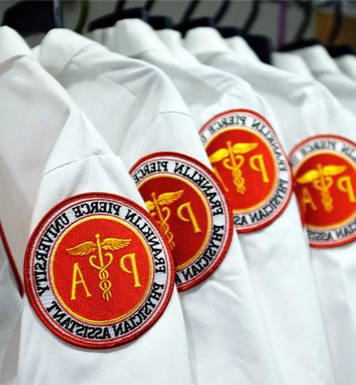 White coat with badge.